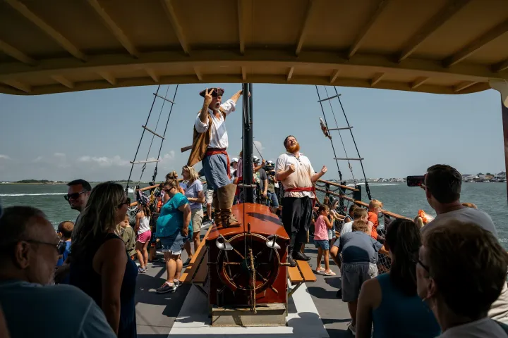 a group of people standing in front of a crowd