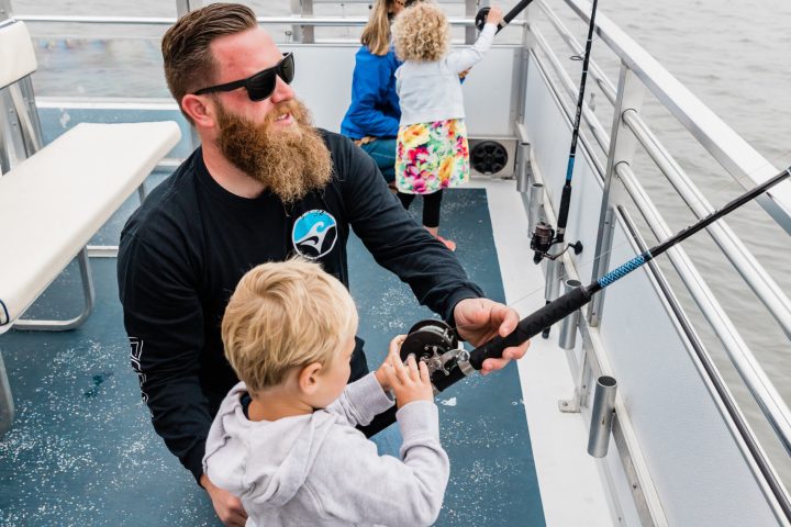 a man standing on a boat in the water