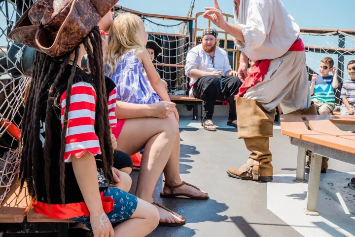 a group of people sitting on a bench