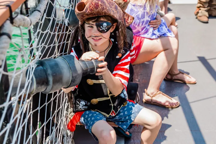 a group of people sitting at a zoo