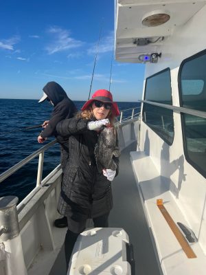 a person standing on a boat in the water