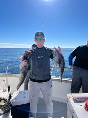 a couple of people that are standing in the water