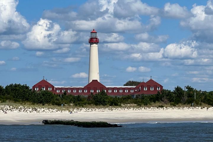 a clock tower in the middle of a body of water